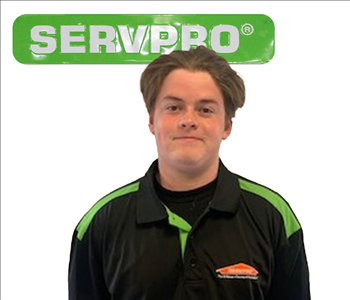 Evan, male, SERVPRO employee against a white background and green SERVPRO logo